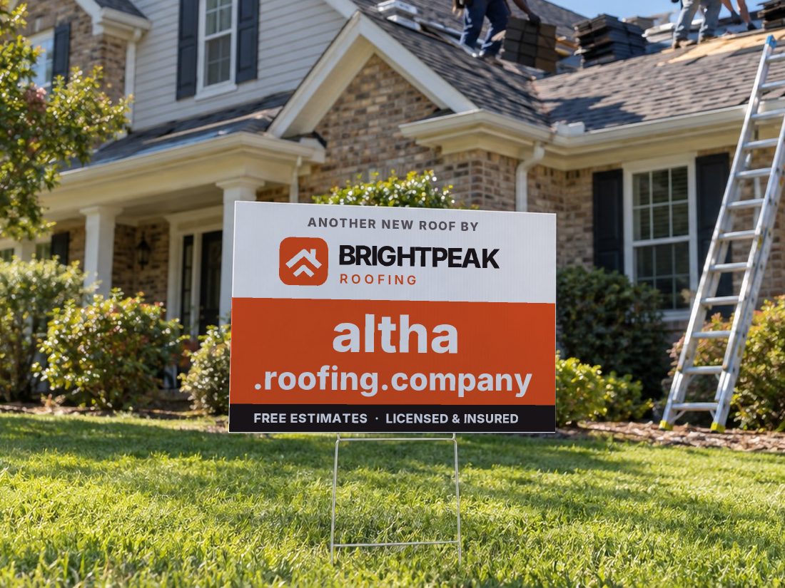 altha.roofing.company on a yard sign in front of a house getting a new roof